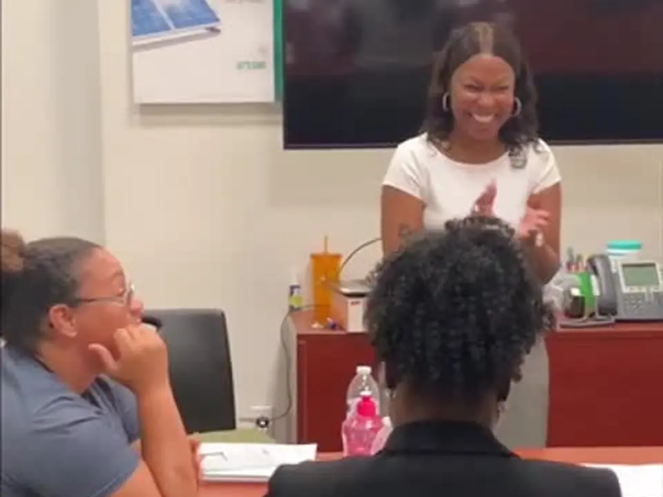 Angela Finley smiling and responding during an interactive workshop discussion